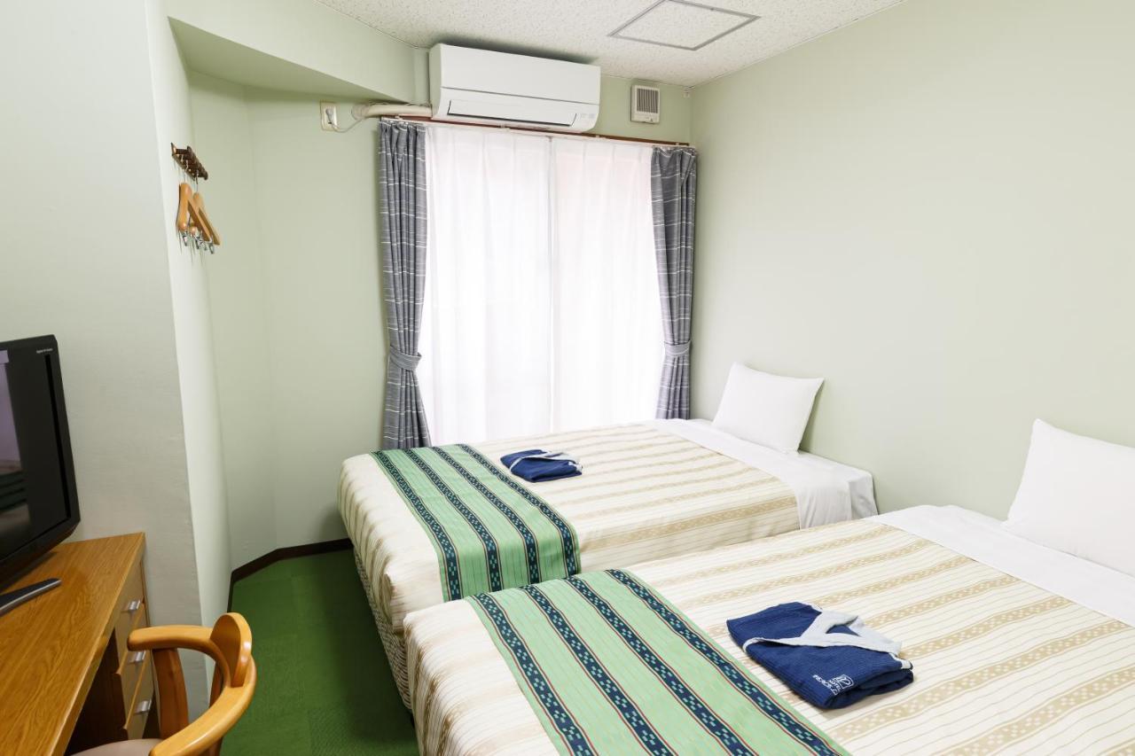Hotel Peace Land Kume Naha Bagian luar foto