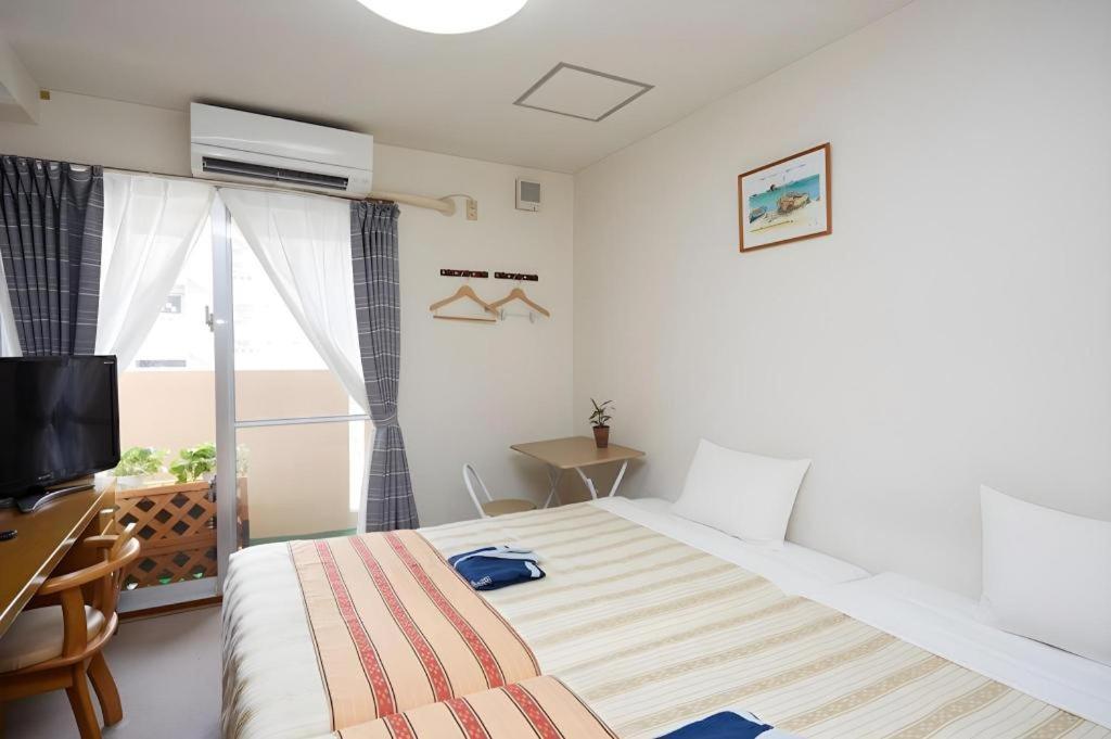 Hotel Peace Land Kume Naha Bagian luar foto