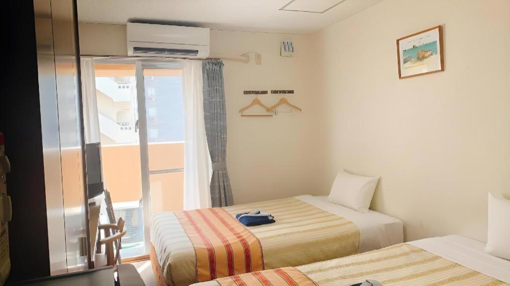 Hotel Peace Land Kume Naha Bagian luar foto