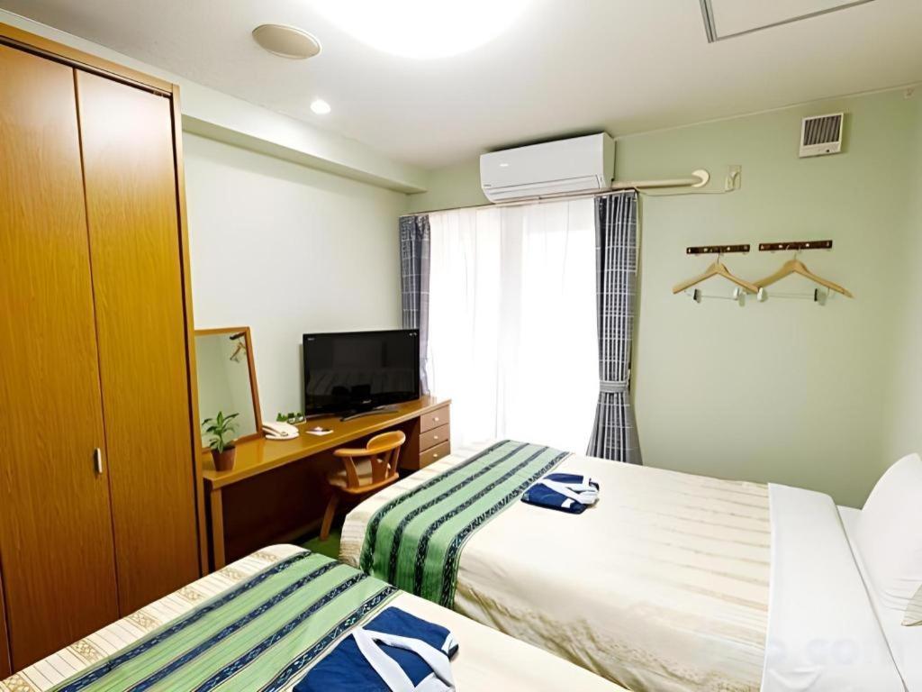 Hotel Peace Land Kume Naha Bagian luar foto