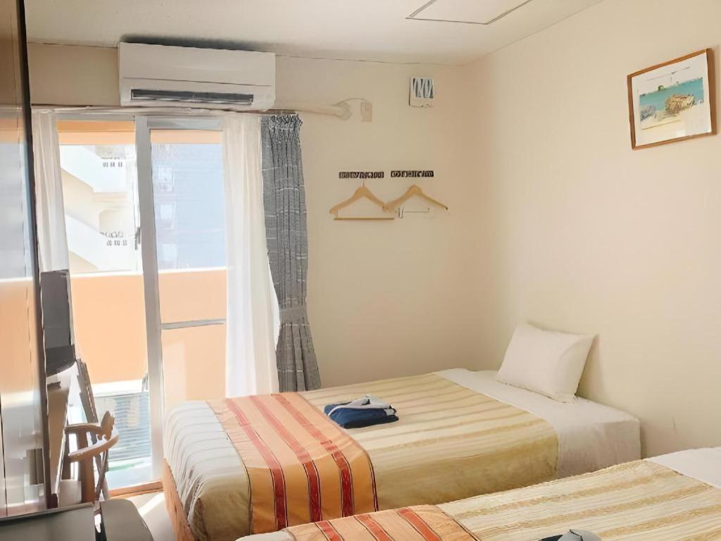 Hotel Peace Land Kume Naha Bagian luar foto