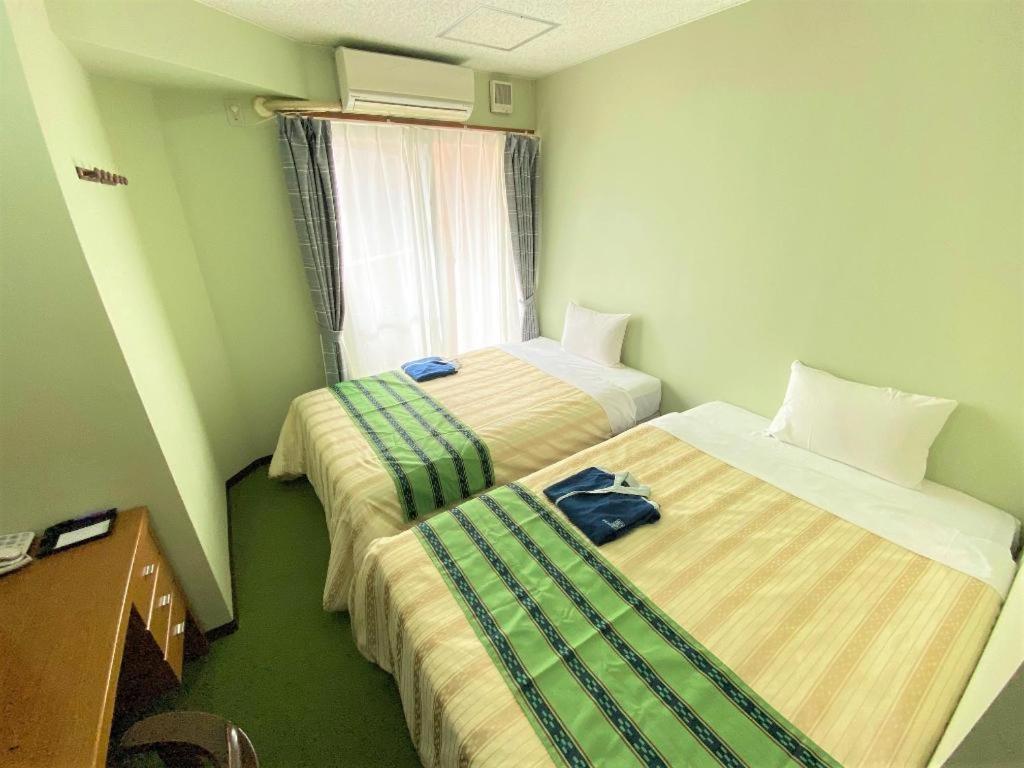 Hotel Peace Land Kume Naha Bagian luar foto